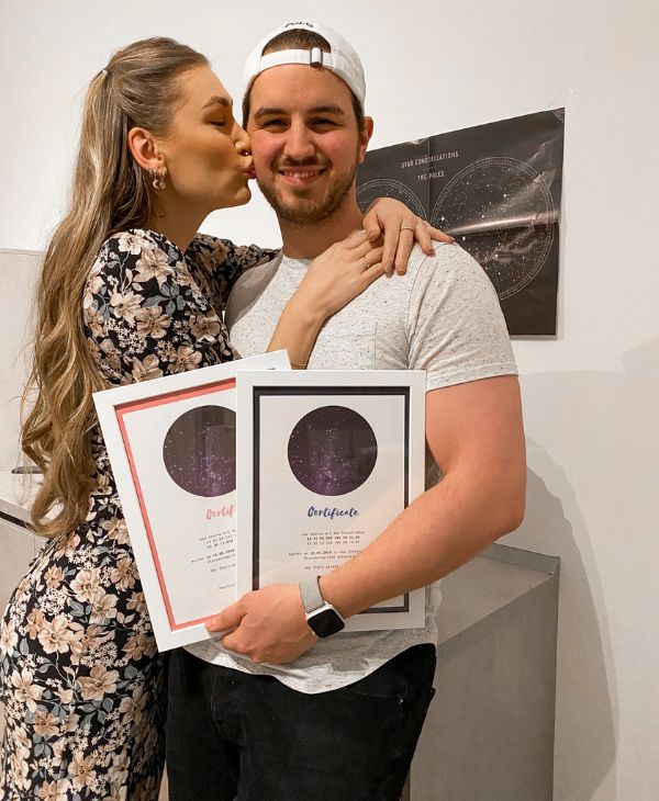 Young couple in love showing their name a star certificated